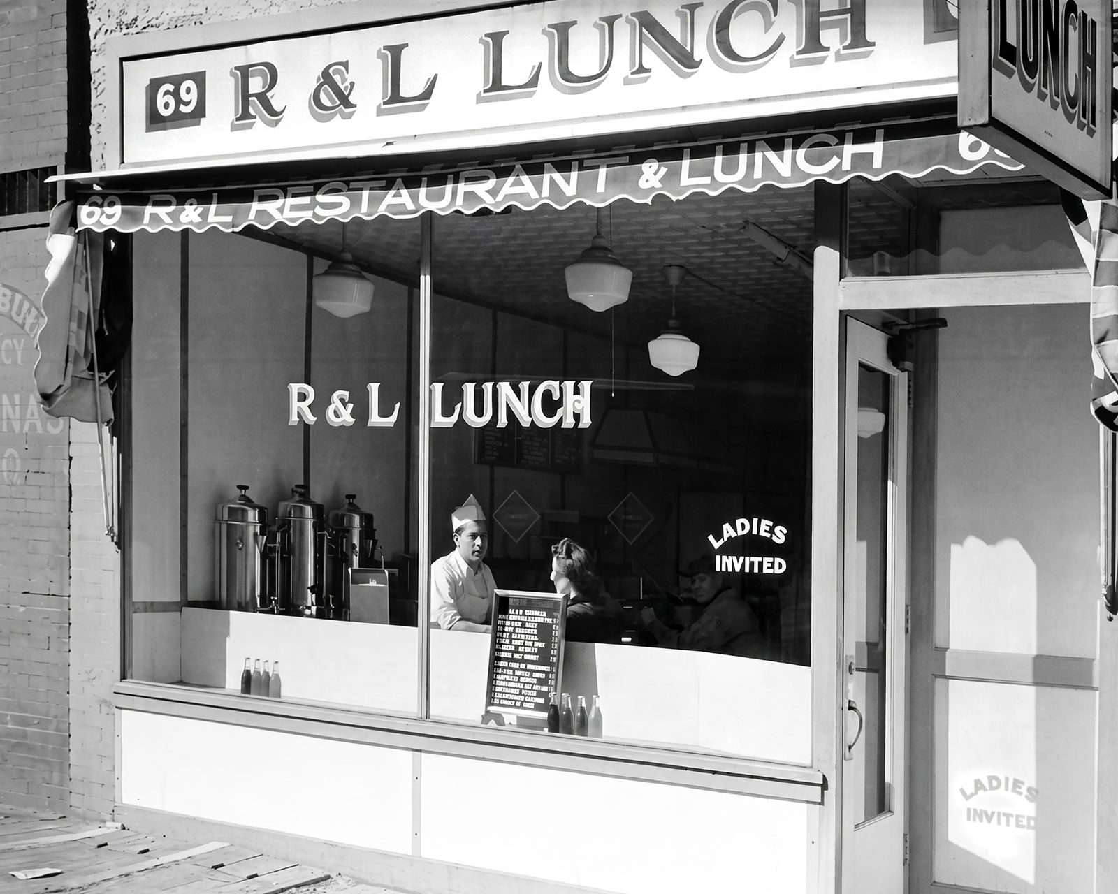 R&L Lunch at 69 Gansevoort Street in 1938, with Ladies Invited lettering on the window