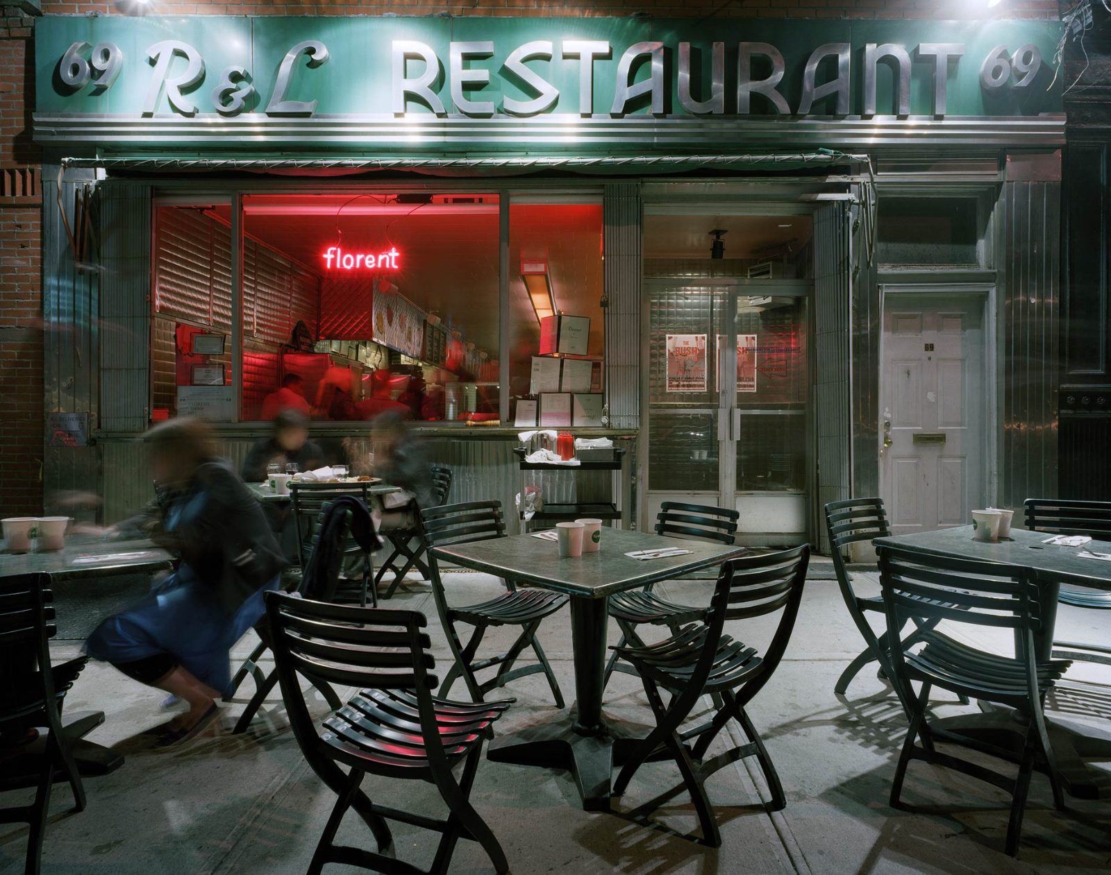 69 Gansevoort Street at night during the Florent years: the R&L Restaurant marquee above the storefront and pink Florent neon in the window
